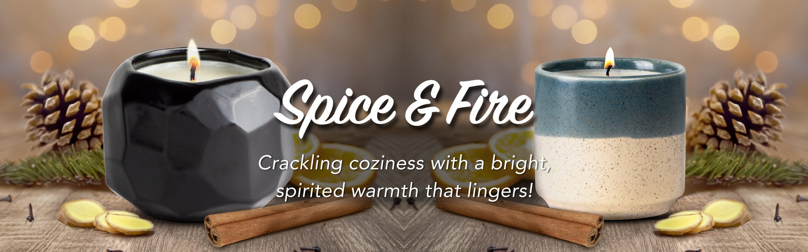 Two candles labeled 'Spice & Fire' with decorative elements on a wooden surface.